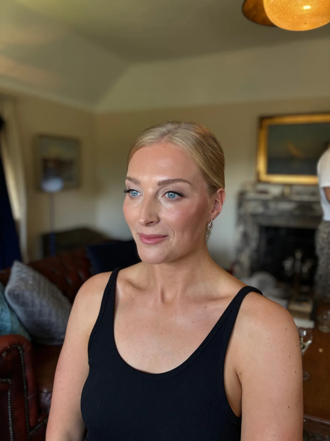 Soft, natural bridal makeup on a bride getting ready