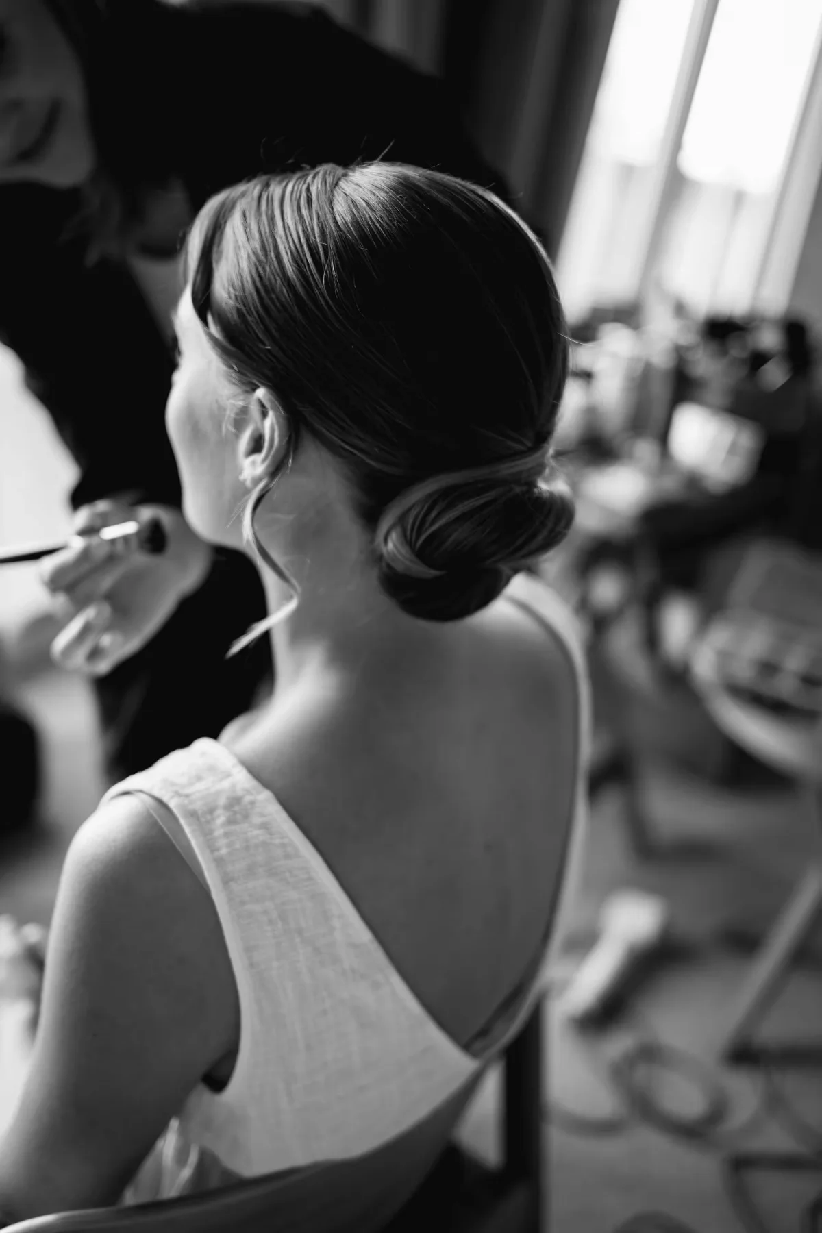 A bride getting ready on her wedding morning, black and white